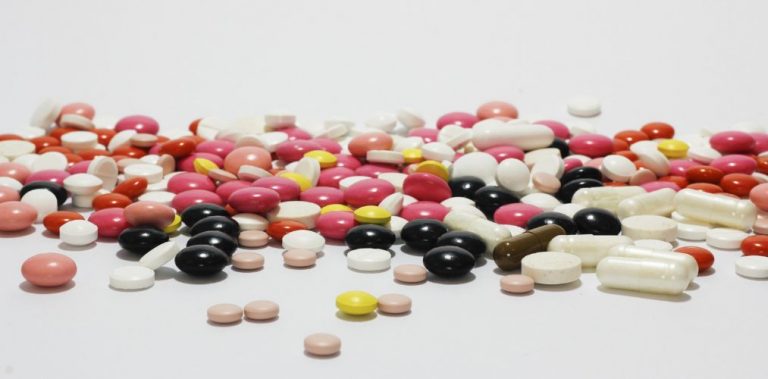 An assortment of pills on a white background.