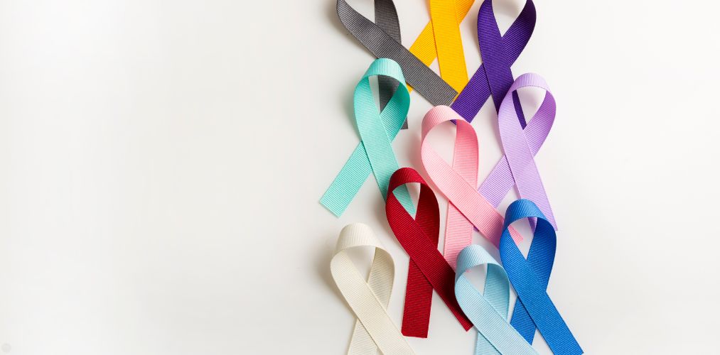 Various cancer ribbons on a white background.